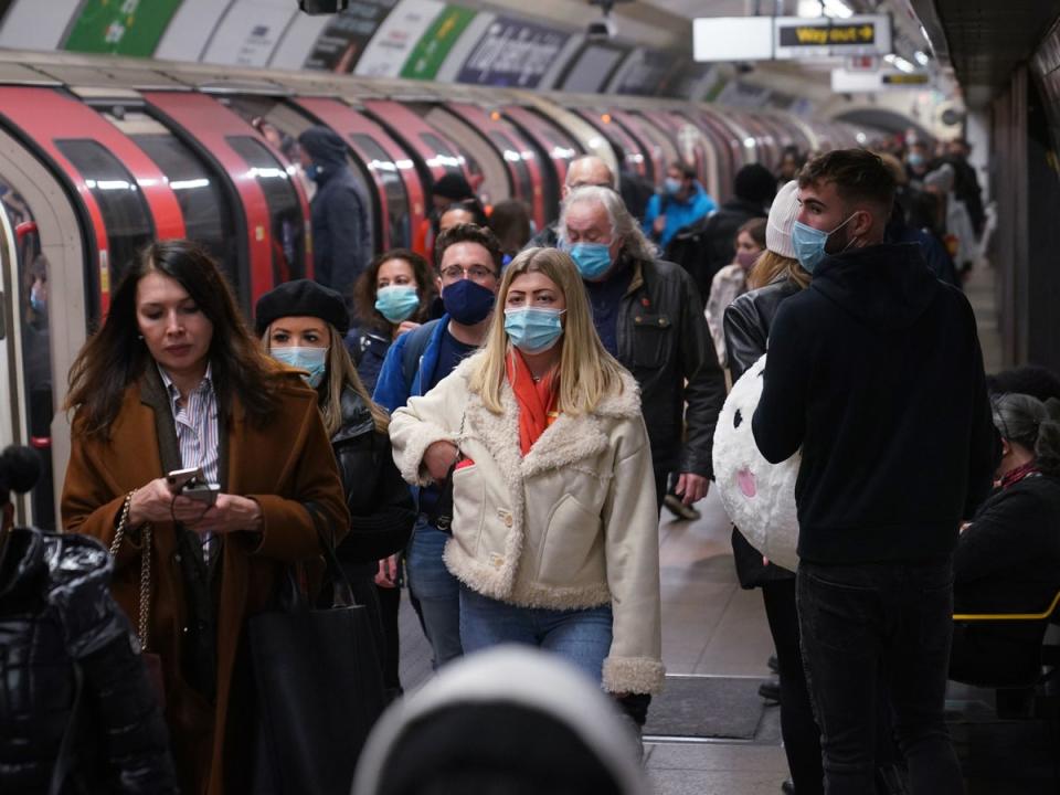 File photo: Commuters on the Tube network in London wear masks during a rise in Covid cases (PA)