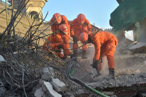 Rescuers have used concrete cutters and excavators to claw through the rubble of the collapsed Lombok mosque