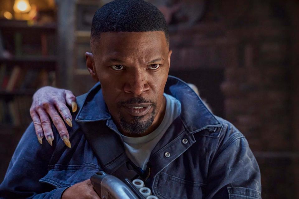 Jamie Foxx with a vampire hand on his shoulder