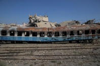 A destroyed carriage is seen from a train traveling through the outskirts of Damascus towards recently opened international fair in Damascus, Syria, September 15, 2018. REUTERS/Marko Djurica/Files