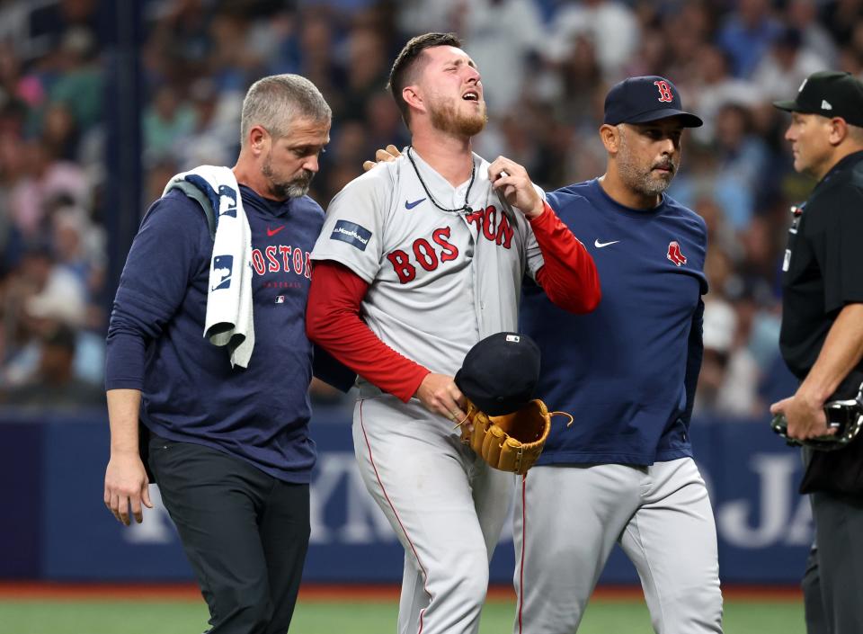 Boston Red Sox relief pitcher Zack Kelly exits Wednesday night's game against the Tampa Bay Rays.