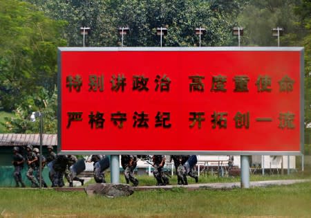 Chinese troops conduct riot drills inside a People's Liberation Army base in Tam Mei, Hong Kong