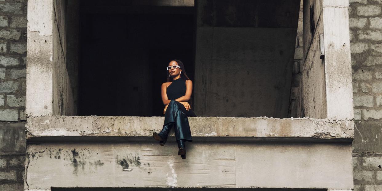 woman sitting in the middle of a construction site