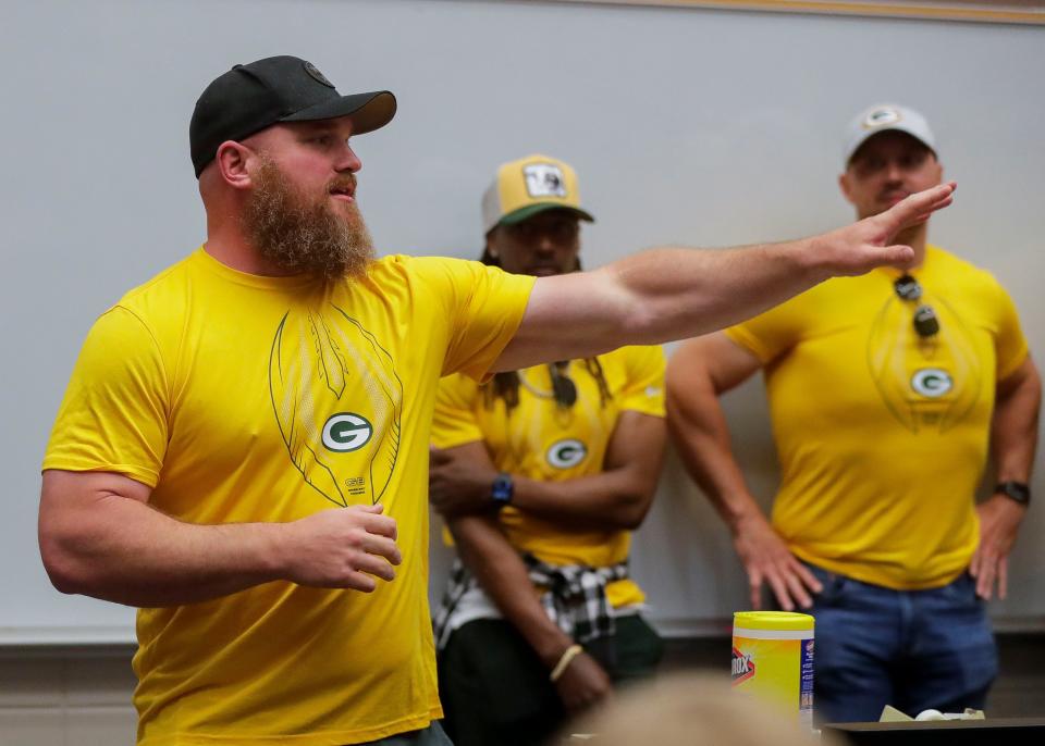 Former Green Bay Packers offensive lineman Scott Wells addresses students during the 2022 Green Bay Packers Road Trip on Thursday at Wausau East High School.