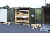 In this July 13, 2017, image provided by the U.S. Army Criminal Investigation Command on Feb. 9, 2021, a storage container of explosive ordnance shows signs of theft after arriving at the Letterkenny Army Depot in Chambersburg, Pa. An ammunition canister containing 32 rounds of 40mm M430A1 grenades, property of the U.S. Marine Corps, was missing. (U.S. Army Criminal Investigation Command via AP)