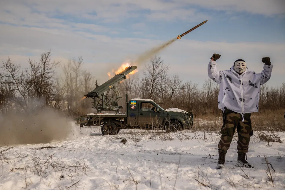A Ukrainian soldier in a mask stands near an improvised multiple rocket launcher during firing on Russian positions on Jan. 15, 2024 in Donetsk Oblast, Ukraine.