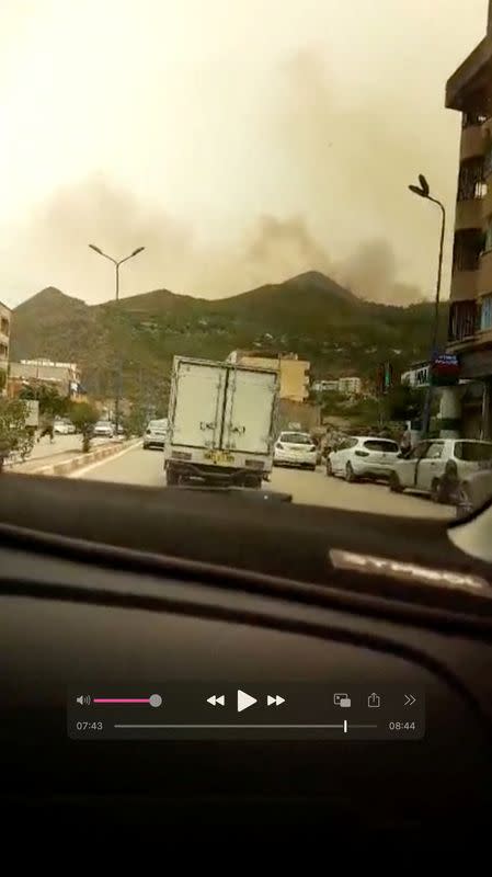 Smoke rises following a wildfire in Bejaia