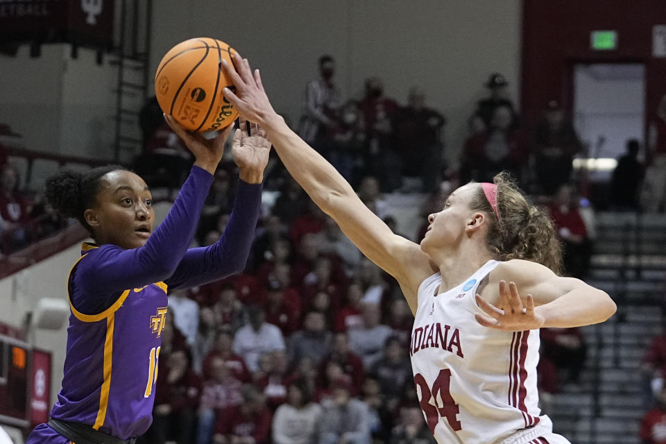 Tennessee Tech's Maaliya Owens (11) has her shot blocked by Indiana's Grace Berger (34) during the second half of a first-round college basketball game in the women's NCAA Tournament Saturday, March 18, 2023, in Bloomington, Ind. (AP Photo/Darron Cummings)