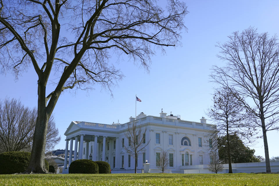 An American flag flies above the White House in Washington, Sunday, Jan. 10, 2021. (AP Photo/Patrick Semansky)