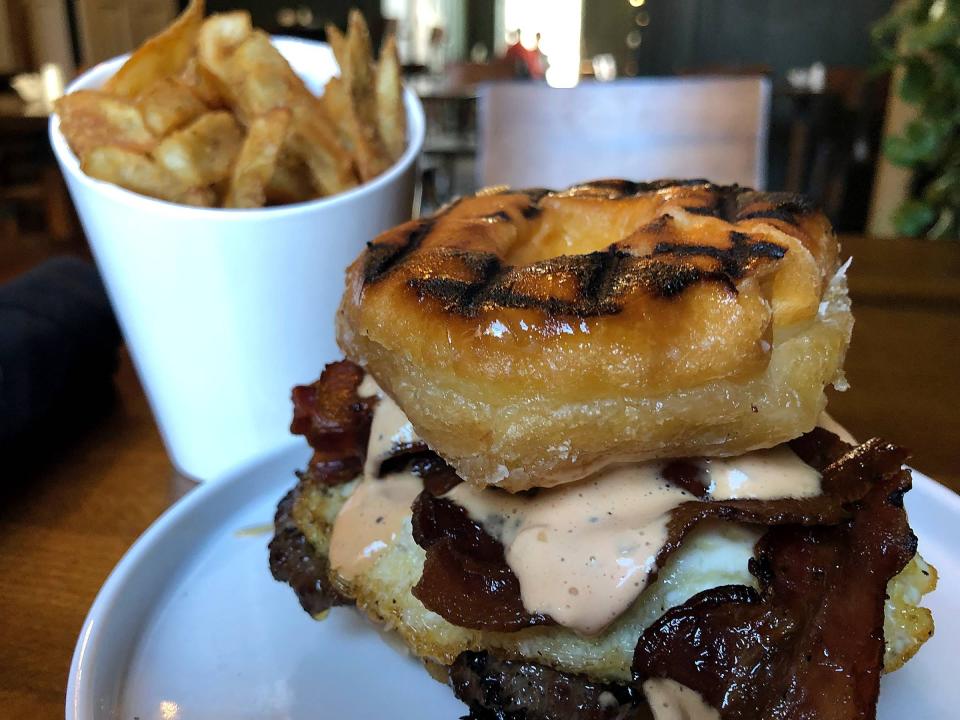 Bricks at Cashier's House serves dry-aged steaks and gourmet burgers such as this Mighty Fine Breakfast Burger, which features a grilled Mighty Fine doughnut with a burger, bacon, a fried egg, American cheese and a special tangy sauce called zesty aioli. It comes with french fries and runs $18. 