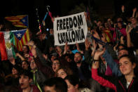 People react as they gather at Plaza Catalunya after voting ended for the banned independence referendum, in Barcelona, Spain October 1, 2017. REUTERS/Susana Vera