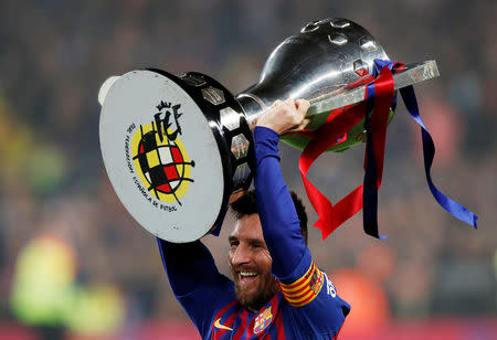 Soccer Football - La Liga Santander - FC Barcelona v Levante - Camp Nou, Barcelona, Spain - April 27, 2019 Barcelona's Lionel Messi celebrates winning La Liga with the trophy REUTERS/Albert Gea