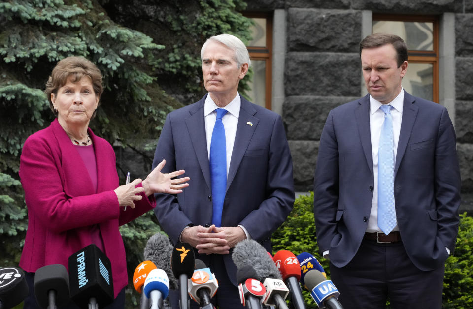 From left to right, U.S. Senators Jeanne Shaheen, D-N.H., Rob Portman, R-Ohio, and Chris Murphy D-Conn., give a briefing at Ukrainian Presidential office after their meeting with Ukrainian President Volodymyr Zelenskiy in Kyiv, Ukraine, Wednesday, June 2, 2021. (AP Photo/Efrem Lukatsky)