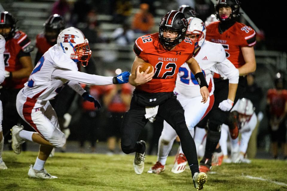 Hillcrest quarterback Benett Judy (12) attempts to evade Riverside defense during their game Friday, Nov. 5, 2021.