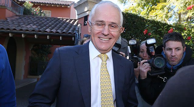 Malcolm Turnbull leaves his home in a media swarm. Source: AAP