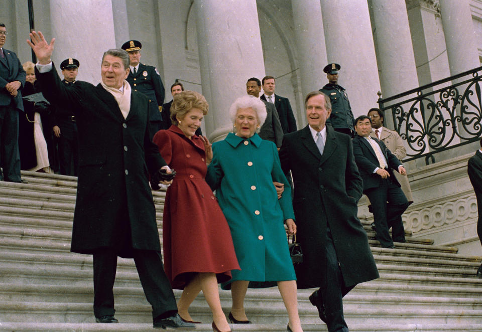 Former President Ronald Reagan, his wife, Nancy, new first lady Barbara Bush and President George H.W. Bush walk down the Capitol steps after the inaugural ceremony, Jan. 20, 1989. (Photo: J. Scott Applewhite/AP)