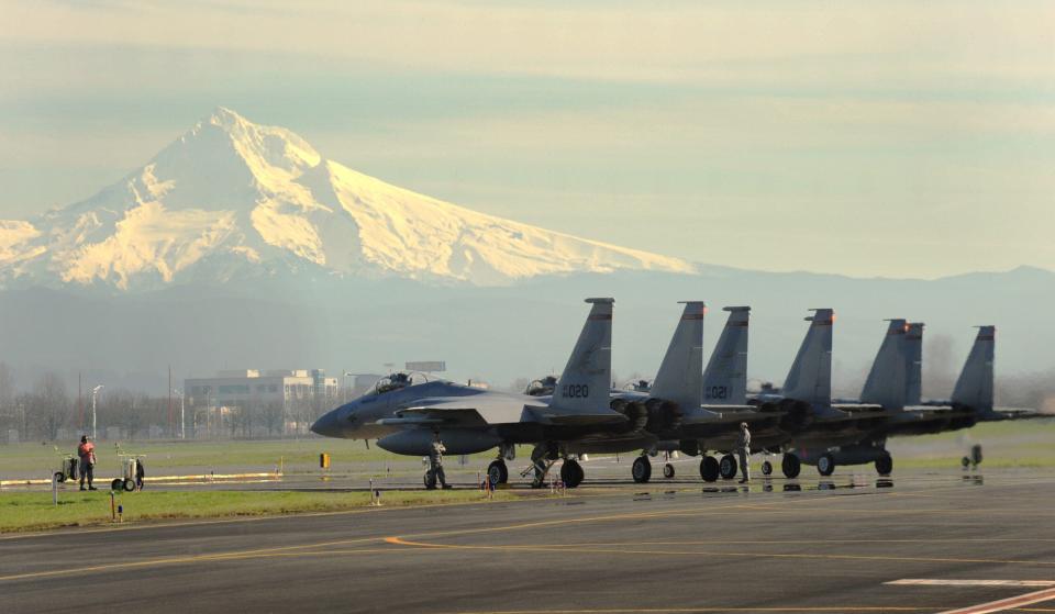 A group of F-15C and F-15D model Eagles assigned to the 123rd Fighter Squadron, 142nd Fighter Wing prepare to take off for their afternoon training mission in the shadow of Mount Hood from the Portland Air National Guard Base, Ore., Feb. 12, 2015. (U.S. Air National Guard photo by Tech. Sgt. John Hughel, 142nd Fighter Wing Public Affairs/Released)