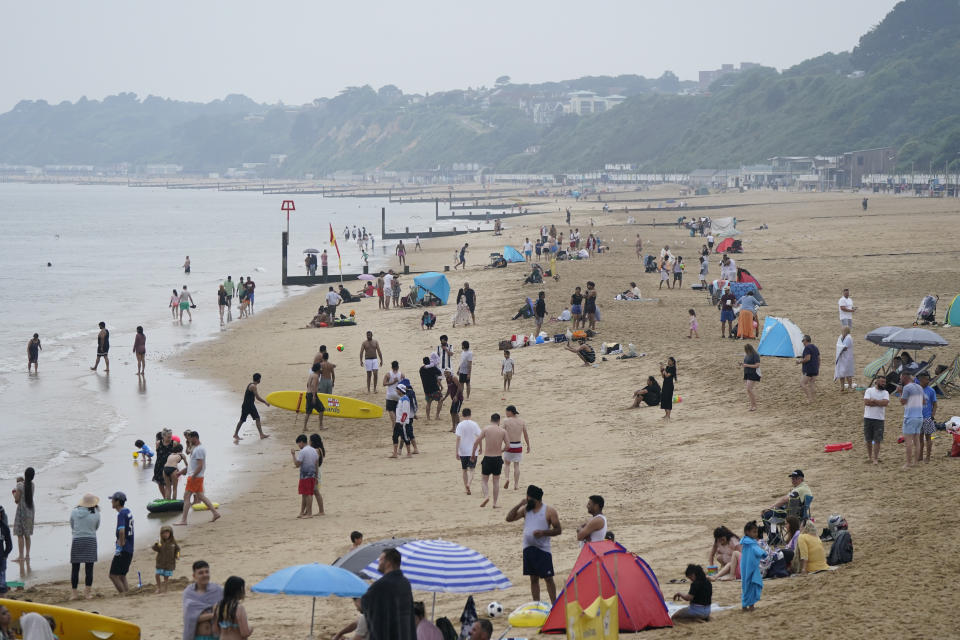 Beachgoers at an overcast Bournemouth beach in Dorset. The Met Office has issued guidance that most of the UK will meet heatwave criteria next week, and an amber alert for hot weather for hot weather has been issued by the UK Health Security Agency (UKHSA). Picture date: Sunday June 11, 2023. (Photo by Andrew Matthews/PA Images via Getty Images)