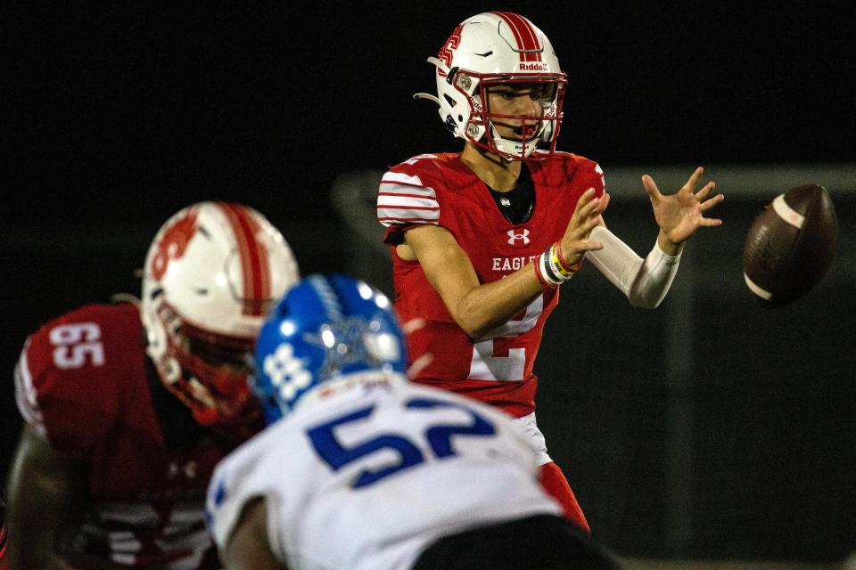 Smyrna freshman Drew Marks (2) receives the snap against Middletown during the football game at Smyrna High, Friday, Oct. 6, 2023. Middletown won 14-12.