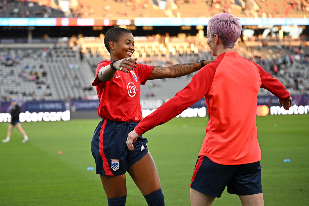 Nov 11, 2023; San Diego, California, USA; OL Reign forward Tziarra King (23) hugs forward Megan Rapinoe (15) during warmups before the 2023 NWSL Championship match against New Jersey/New York Gotham FC at Snapdragon Stadium. Mandatory Credit: Orlando Ramirez-USA TODAY Sports