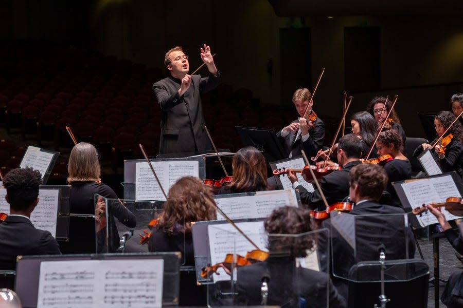 Former Southwest Florida Symphony music director Radu Paponiu conducting the orchestra in a 2024 publicity photo.