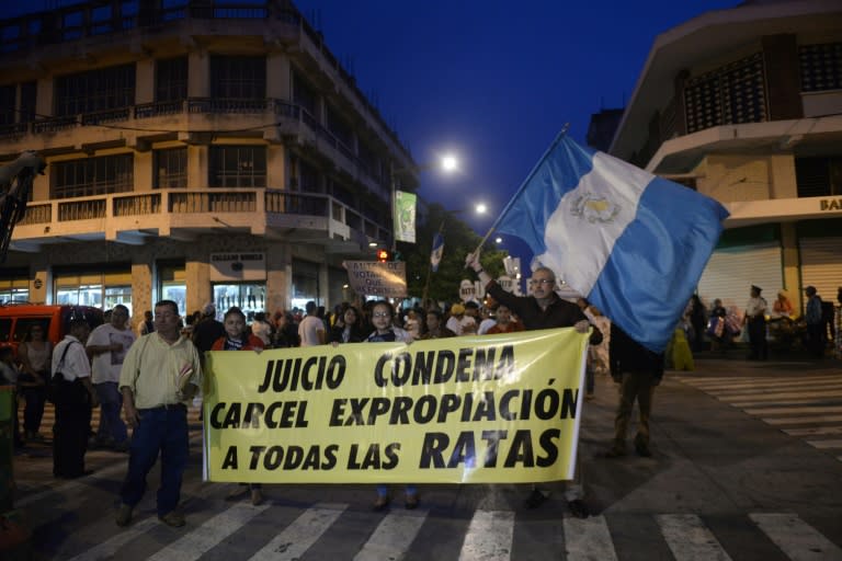 People take part in a demonstration demanding the resignation of Guatemalan President Otto Perez, as a corruption scandal rocks the government, in Guatemala City, on July 4, 2015