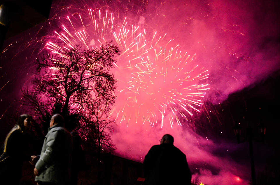 <p>Fireworks explode over the Bulgarian border town of Svilengrad, which is located some 260 km east the capital of Sofia, and some 15 km the Kapitan Andreevo border crossing point with Turkey, during New Year’s eve on January 1, 2018. A lot of people gathered to celebrate New Year, Svilengrad, Bulgaria on January 1, 2018. (Photo: Hristo Rusev/NurPhoto via Getty Images) </p>