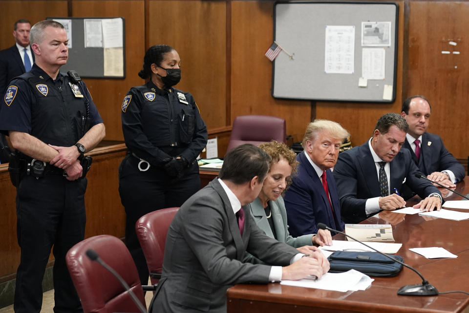 Former President Donald Trump appears in court for his arraignment, Tuesday, April 4, 2023, in New York. Trump surrendered to authorities ahead of his arraignment on criminal charges stemming from a hush money payment to a porn actor during his 2016 campaign. (AP Photo/Seth Wenig, Pool)