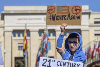 <p>American students and expats hold signs calling for stricter gun control during in a solidarity rally with March For Our Lives on the Place des Nations in front of the European headquarters of the United Nations in Geneva, Switzerland. (Photo: Martial Trezzini/Keystone via AP) </p>