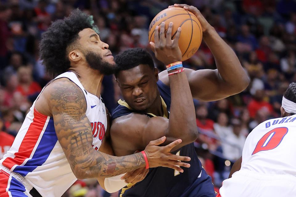 Pelicans forward Zion Williamson drives against Pistons forward Saddiq Bey in the first half on Wednesday, Dec. 7, 2022, in New Orleans.