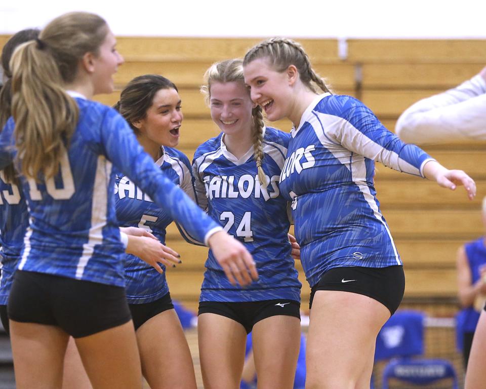 Scituate's Evelyn Flynn, Scituate's Sumner Harris, and Scituate's Lauren Thompson celebrate their win over South High Community in the preliminary round of the Division 2 state tournament at Scituate High on Wednesday, Nov. 1, 2023. Scituate would go on to win in straight sets, 25-16, 25-12, 25-14.