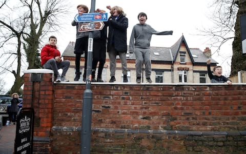 Young fans outside Anfield - Credit: Action Images via Reuters