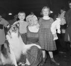 <p>Dressed in tartan jumpers and high collared shirt dresses, Jayne Mansfield matches with her daughter, Jayne Marie. The actress was attending the Hollywood Christmas parade with her family.</p>