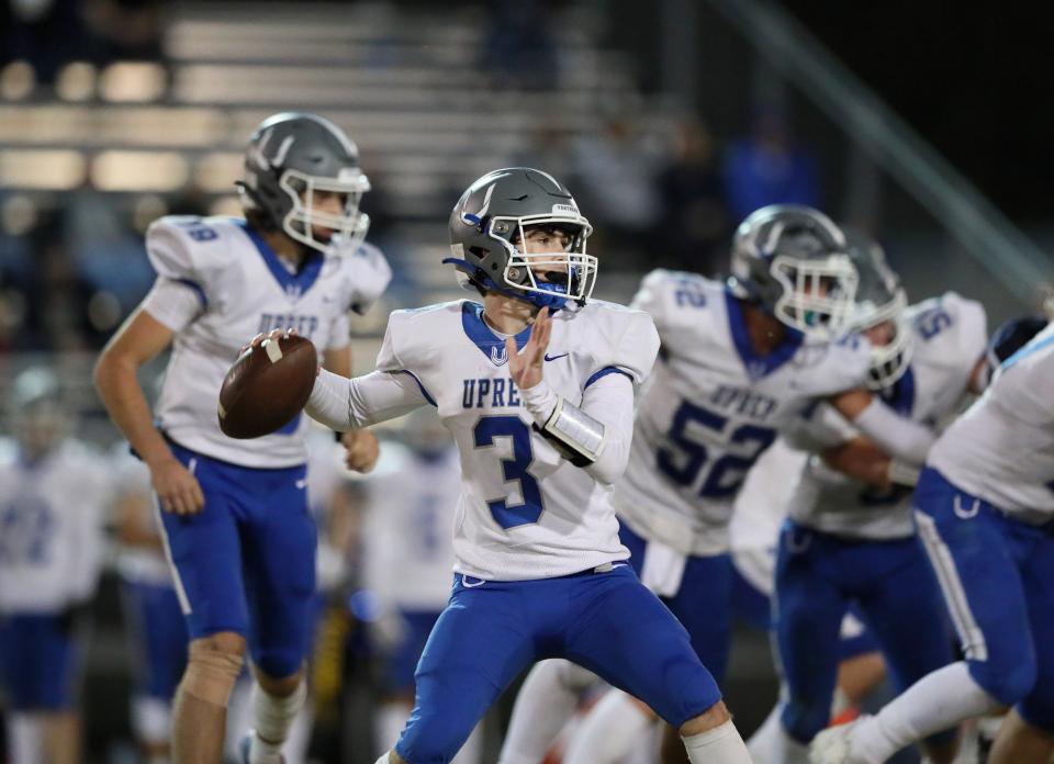 U-Prep’s Kaos Martin (3) looks toward the end zone to pass the ball to a teammate in the third quarter.