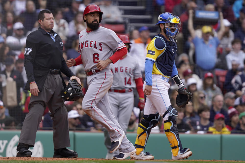 Los Angeles Angels' Anthony Rendon (6) scores on a single by Angels' Brandon Drury as Boston Red Sox's Connor Wong, right, looks on in the second inning of a baseball game Sunday, April 16, 2023, in Boston. (AP Photo/Steven Senne)