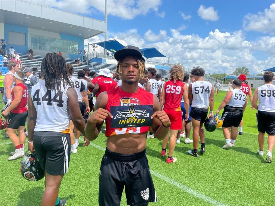 Naples High School defensive back Jonas Duclona  stands with his US All- American Bowl Game invitation after the FBU Top Gun Showcase Sunday, July, 10 at the Paradise Coast Sports Complex.