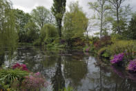 The Japanese-inspired water garden of Claude Monet's house, French impressionist painter who lived from 1883 to 1926, waits ahead of the re-opening, in Giverny, west of Paris, Monday May 17, 2021. Lucky visitors who'll be allowed back into Claude Monet's house and gardens for the first time in over six months from Wednesday will be treated to a riot of color, with tulips, peonies, forget-me-nots and an array of other flowers all competing for attention. (AP Photo/Francois Mori)