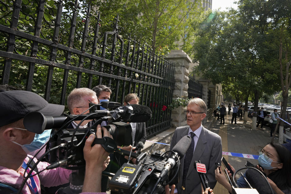 Australian ambassador to China Graham Fletcher, center, speaks to reporters outside the No. 2 Intermediate People's Court after he was denied to attend the espionage charges case for Yang Hengjun, in Beijing, Thursday, May 27, 2021. Fletcher said it was “regrettable” that the embassy was denied access Thursday as a trial was due to start for Yang, a Chinese Australian man charged with espionage. (AP Photo/Andy Wong)