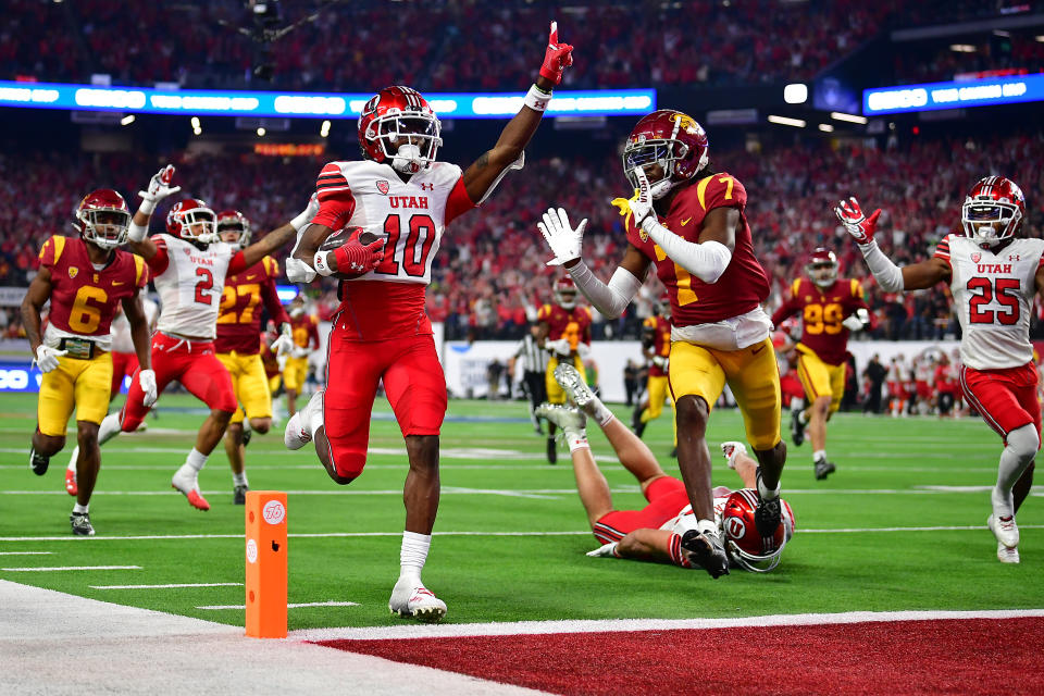 Dec. 2, 2022; Las Vegas, Nevada; Utah Utes wide receiver Money Parks (10) runs the ball for a touchdown against the Southern California Trojans during the second half of the PAC-12 Football Championship at Allegiant Stadium. Gary A. Vasquez-USA TODAY Sports