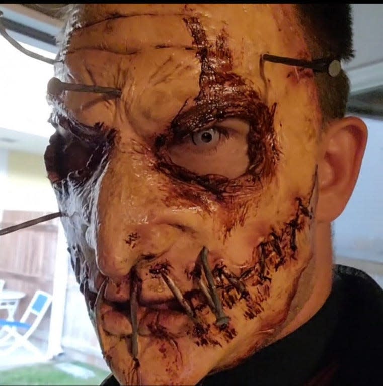 Horror fan Ian Eubanks does his own make-up for his haunted houses and other events.