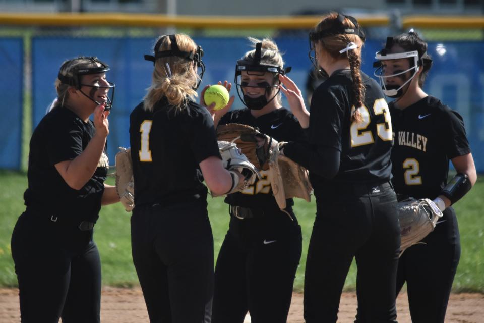 Lily Hickman (1) celebrates with infielders Kaitlyn Eastridge, Brynne Buchanan (22), Ashlyn Bonta (2) and Tynley Kluesner (23) after a strikeout against Mitchell.