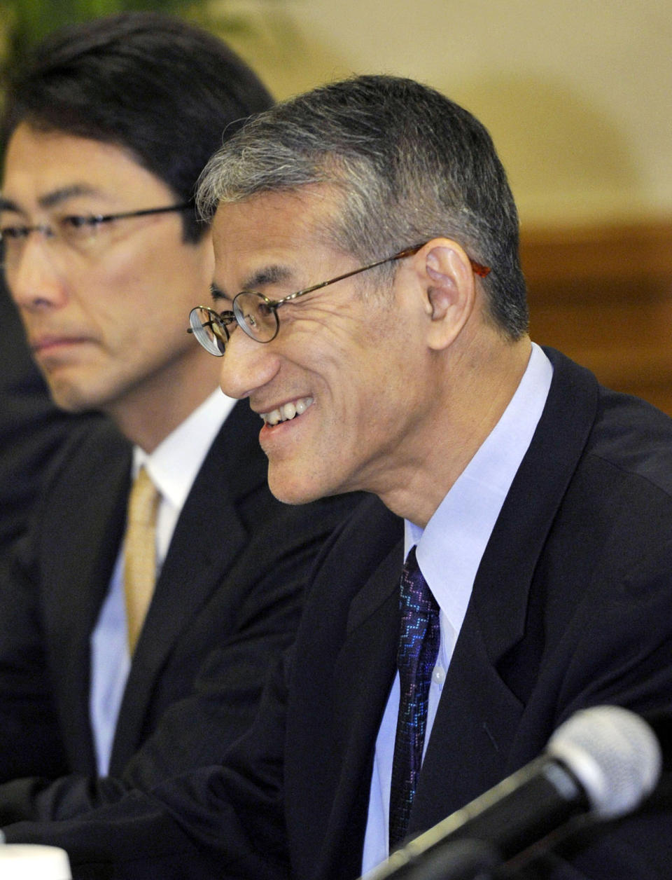 Osamu Tasaka, right, director general of the International Department at the Japanese Red Cross, attends a meeting with Ri Ho Rim, secretary general of North Korea's Red Cross Society, in Shenyang, China, Monday, March 3, 2014. The Japanese and North Korean Red Cross officials met in China to discuss the repatriation of remains of Japanese buried in North Korea and left behind after World War II. (AP Photo/Kyodo News) JAPAN OUT, CREDIT MANDATORY