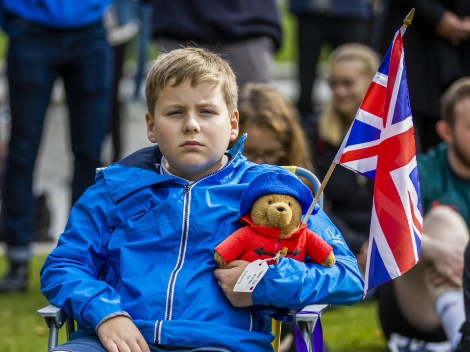 Tom Murray (9) with his Paddington Bear that has a special message thanking the Queen (Liam McBurney/PA) (PA Wire)