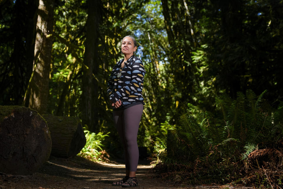 Amelia Marchand, citizen of the Confederated Tribes of the Colville Reservation, poses for a portrait at NatureBridge in the Olympic National Park during the 2023 Tribal Climate Camp, Thursday, Aug. 17, 2023, near Port Angeles, Wash. Participants representing at least 28 tribes and intertribal organizations gathered to connect and share knowledge as they work to adapt to climate change that disproportionally affects Indigenous communities. More than 70 tribes have taken part in the camps that have been held across the United States since 2016. (AP Photo/Lindsey Wasson)