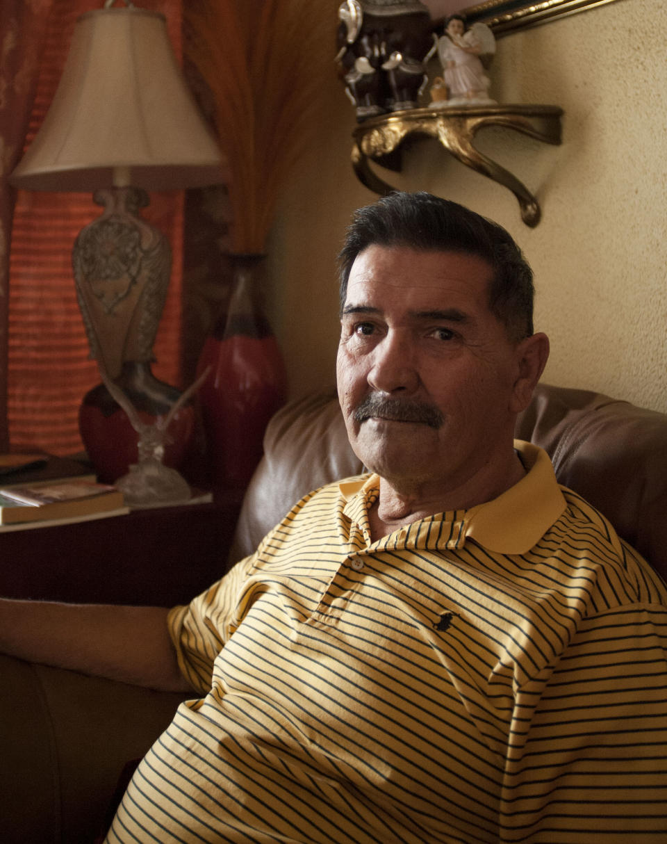 Medal of Honor recipient Santiago Erevia, is photographed on Saturday, Feb. 22, 2014, at his home in San Antonio, Texas. Erevia is one of twenty-four army veterans who will receive the award following a congressionally mandated review conducted to ensure that eligible award recipients were not bypassed due to prejudice. (AP Photo/Darren Abate)