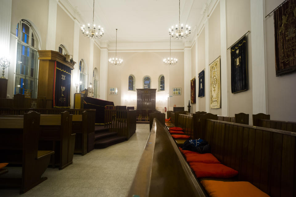 This Wednesday, March 20, 2019 photo shows a view inside the prayer room of the so-called youth-synagogue, the remaining building of the 'Fraenkelufer' synagogue, in Berlin. The synagogue was able to receive about 2000 prayers before it was destroyed by the Nazis. In the German capital, efforts are underway to rebuild the synagogue. (AP Photo/Markus Schreiber)