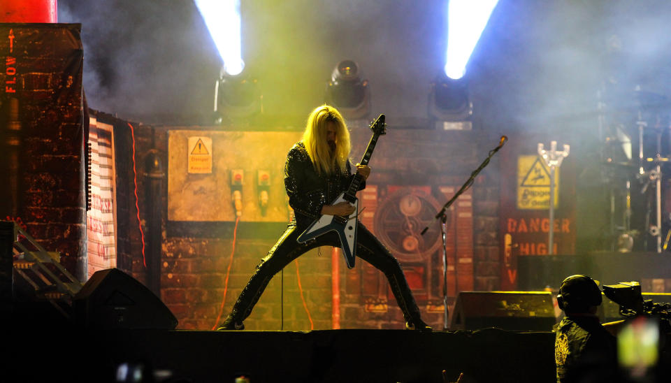 Richie Faulkner performs onstage with Judas Priest at Foro Pegaso in Toluca, Mexico on December 3, 2022