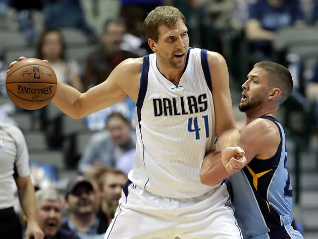 Dirk Nowitzki posts up friend of the program Chandler Parsons. (Getty Images)