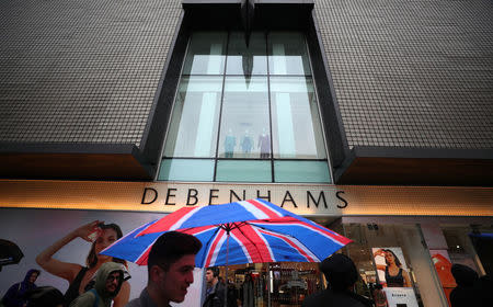 Shoppers walk past Debenhams on Oxford Street in central London, Britain, April 2, 2018. REUTERS/Hannah McKay