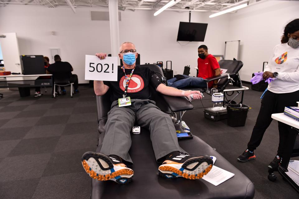 Shaun Brennan donates blood for the 502nd time at the American Red Cross in Memphis on Nov. 11, 2021.